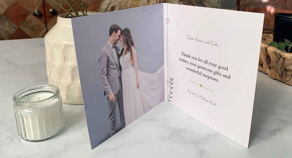 A cheerful thank-you card shows a couple in formal attire, featuring a message of appreciation inside.