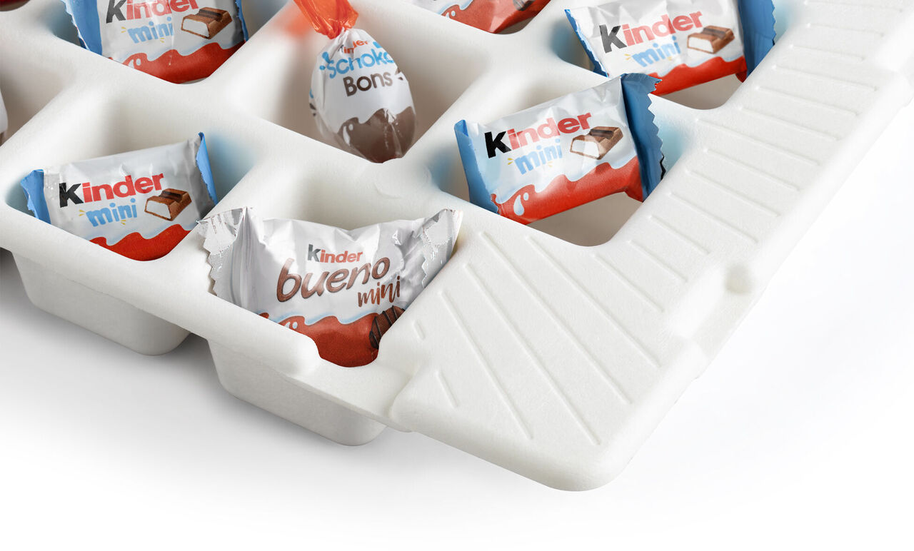 A selection of Kinder chocolates in a white container, ideal for sharing.