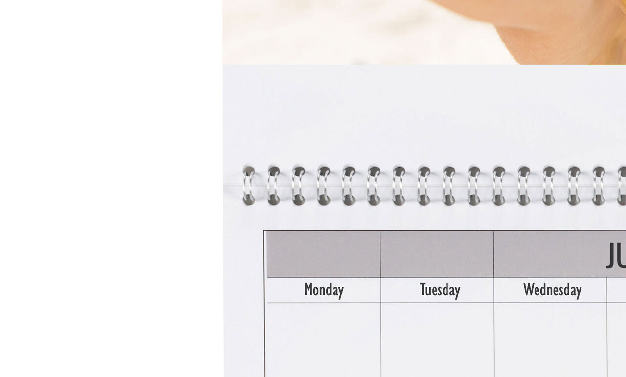 Overview of a June calendar with weekdays and a spiral edge.
