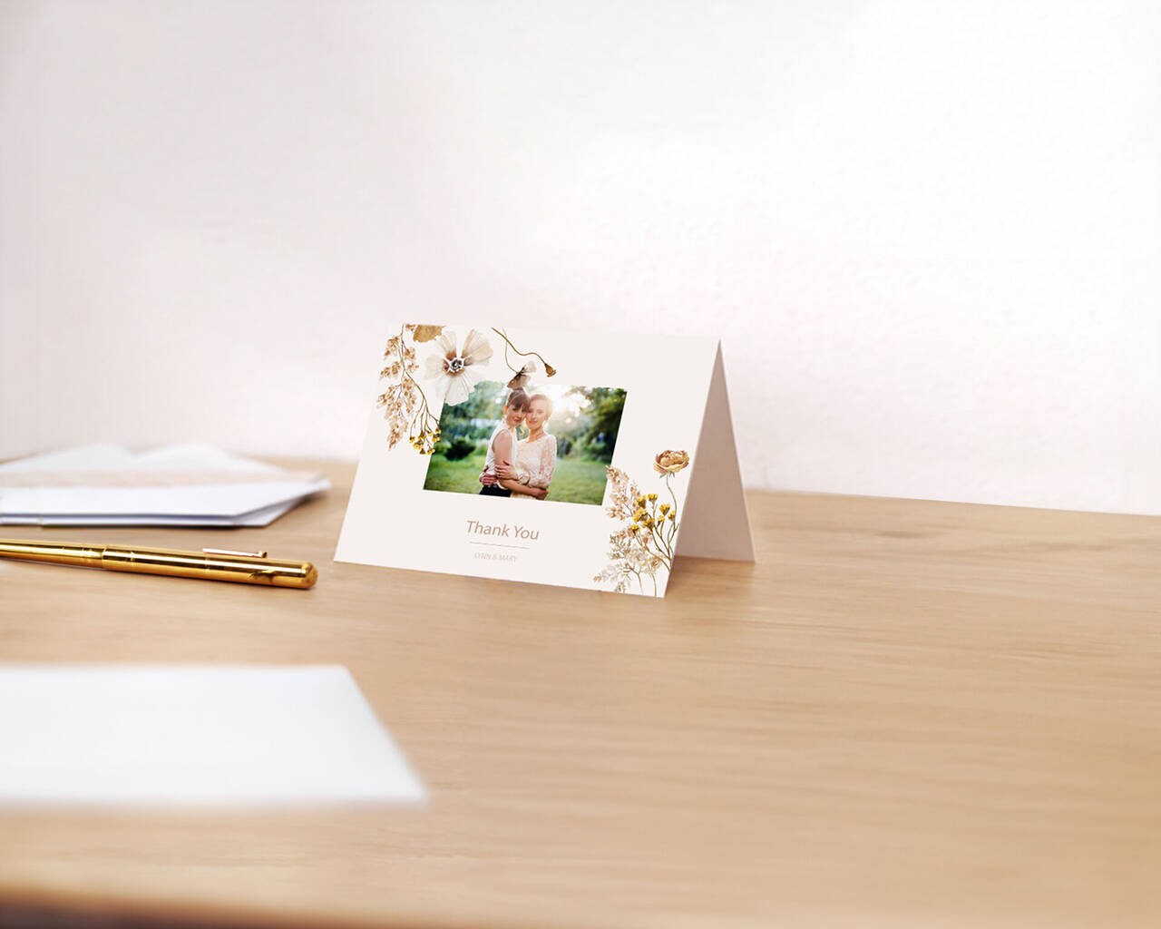 Greeting card with a photo and "Thank You" text on a desk