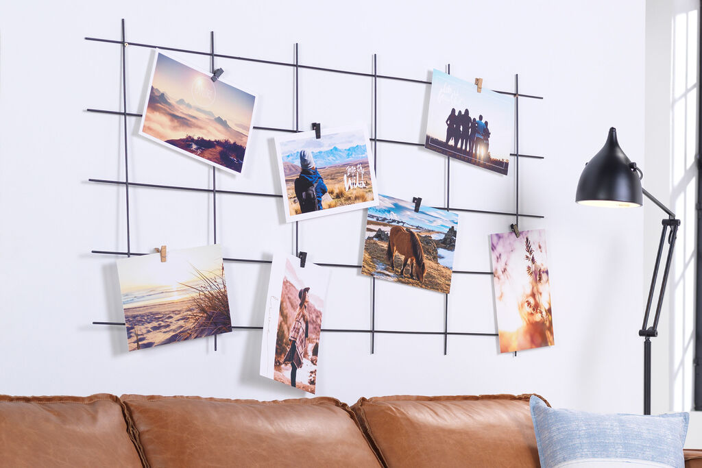 Decorative wall with photos hanging in the living room