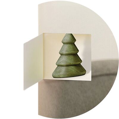A creative popup image of a green Christmas tree in a photo book.