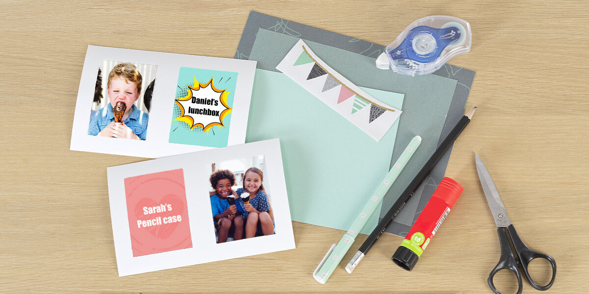 Crafting materials and personalized cards on a table.